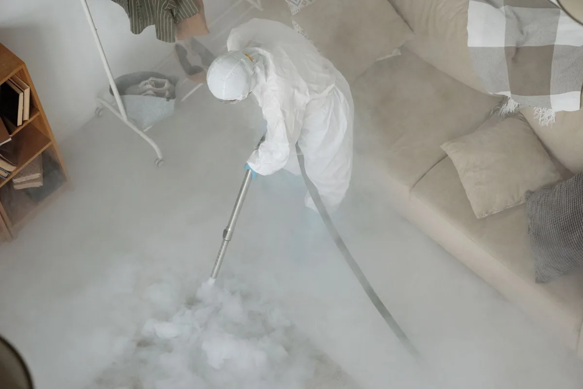 Biohazard cleanup technician in protective equipment, Jackson, GA